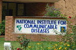 the marquee outside building reads national institute for communicable diseases
