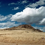 Volcano with blue sky and clouds