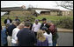 President George W. Bush joins townspeople in prayer Wednesday, May 9, 2007, as he toured a neighborhood in the tornado-ravaged community of Greensburg, Kansas. At least 10 people died in the Friday night storm that destroyed nearly 95 percent of the town. White House photo by Eric Draper