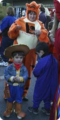 boy dressed as cowboy with woman dressed as Tigger