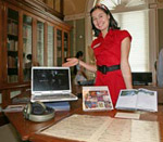 Lydia Welhan standing next to a display of Music Division materials.