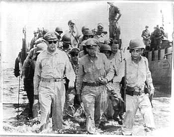 [General Douglas MacArthur and aides wading ashore on Leyte, Philippine Islands]
