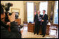 President George W. Bush and 2006 NASCAR Nextel Cup Champion Jimmie Johnson meet in the Oval Office, joined by members of the media, Monday, Feb. 5, 2007, in honor of Johnson's championship NASCAR season. White House photo by Eric Draper