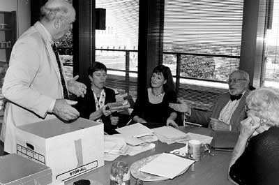 Blair family descendant Richard Hollyday (left) shows some historic family papers that he and his sister Edith Hollyday (far right) found in an attic. With them are Diane Kresh, director for public service collections; Louise Condon, Mr. Hollyday's niece; and Marvin Kranz, American history specialist in the Manuscript Division.