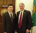 This is an image of Congressman Baird with an intern.