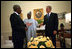 President George W. Bush meets with United Nations Secretary General Kofi Annan, left, and President Olusegun Obasanjo of Nigeria in the Oval Office May 11, 2001. President Bush.s commitment to Africa started long before the announcement of his plan to fight AIDS. He has met with 25 African heads of state and has a wide range of discussions about HIV/AIDS, economy and peace in the region.