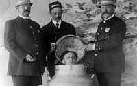 Photograph of Houdini performing the Giant Milk Can Escape