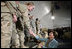 Mrs. Laura Bush greets U.S. and Coalition troops Wednesday, March 1, 2006, during a stopover at Bagram Air Base in Afghanistan, prior to the President and Mrs. Bush visiting India and Pakistan.