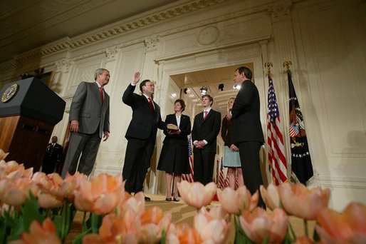 President George W. Bush, left, looks on during the swearing-in ceremony for U.S. Supreme Court Justice Samuel A. Alito, Tuesday, Feb. 1, 2006 in the East Room of the White House, sworn-in by U.S. Supreme Court Chief Justice John Roberts. Altio's wife, Martha-Ann, their son Phil and daughter, Laura, are seen center-background. White House photo by Paul Morse