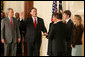 President George W. Bush looks on during the swearing-in ceremony for U.S. Supreme Court Justice Samuel A. Alito, Tuesday, Feb. 1, 2006 in the East Room of the White House, sworn-in by U.S. Supreme Court Chief Justice John Roberts. Alito's wife, Martha-Ann, their son Phil and daughter, Laura, are seen to the right. White House photo by Shealah Craighead