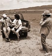 Marilyn Bañuelos (right) photographs Connie Romero as she interviews rancher Corpus Gallegos on the vega, during the 1994 American Folklife Center's field school.