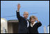 President George W. Bush and Mrs. Laura Bush wave upon their Romanian arrival Tuesday, April 1, 2008, at Henri Coanda International Airport in Bucharest, site of the 2008 NATO Summit.