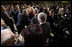 President George W. Bush reaches out to members of the audience Tuesday, April 2, 2008, after he delivered a keynote speech in Bucharest hours before the opening of the two-day NATO Summit.