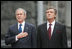 President George W. Bush stands with hand over heart during the playing of the national anthem Tuesday, April 1, 2008, during arrival ceremonies at the Presidential Secretariat in Kyiv. Standing with him is Ukrainian President Viktor Yushchenko.