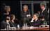 President George W. Bush shares a light moment with Norway's Prime Minister Jens Stoltenberg, left, and Foreign Minister Jonas Gahr Store, right, during the NATO Summit Thursday, April 3, 2008, in Bucharest.