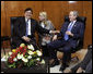 President George W. Bush meets with President Alan Garcia of Peru Sunday morning, Nov. 23, 2008, joined by an interpreter, prior to their participation in further meetings at the 2008 APEC Summit in Lima, Peru. White House photo by Eric Draper