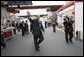 President George W. Bush waves to the media as he arrives Saturday, Nov. 22, 2008, at the Ministry of Defense Convention Center in Lima, Peru, where he addressed the APEC CEO Summit 2008. White House photo by Eric Draper