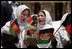 Students sing as they welcome Mrs. Laura Bush to the future site of the Ayenda Learning Center Sunday, June 8, 2008, in Bamiyan, Afghanistan.