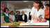 A 3-week-old infant undergoes and examination Wednesday, May 14, 2008, as Mrs. Laura Bush and Mrs. Aliza Olmert, spouse of Israel's Prime Minister Ehud Olmert look on during their visit to the Tipat Chalav-Gonenim Neighborhood Mother and Child Care Center in Jerusalem. Mrs. Bush took time out of her visit to Israel to visit one of 30 care centers in Jerusalem to provide comprehensive health services to children during their first five years of life.