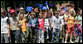 Young children wave American and European Union flags as they wait for President George W. Bush as he participates in a United States - European Union Working Lunch Tuesday, June 10, 2008, at the Brdo Congress Center in Kranj, Slovenia. White House photo by Chris Greenberg