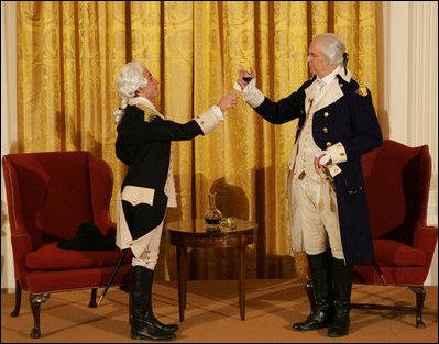 General George Washington (played by Dean Malissa) and General Marie Joseph Paul Yves Roch Gilbert du Motier, the Marquis de LaFayette (played by Benjamin Goldman), toast each other at the beginning of their dialogue Tuesday, Nov. 6, 2007, during the entertainment in the East Room following a dinner in honor of President Nicolas Sarkozy at the White House.