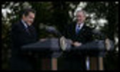 President George W. Bush shares a laugh with President Nicolas Sarkozy of France as they participate in a joint press availability Wednesday, Nov. 7, 2007, at Mount Vernon, Va.