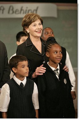 Mrs. Laura Bush stands with students from New York Public School 76 during the President’s statement regarding No Child Left Behind Wednesday, Sept. 26, 2007, in New York. White House photo by Eric Draper