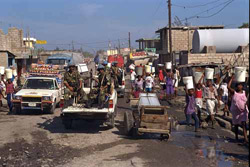 United Nations peace-keeping soldiers from Pakistan, assigned as part of UNSMIH, ride through the crowded streets of Port-au-Prince.