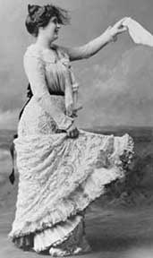Photo: woman in lacy dress waving a handhercheif