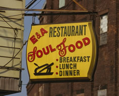 Photo: hanging sign, "E & A Restaurant, Soul Food, Brakfast Lunch Dinner."