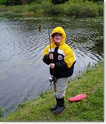 Photo of a child and a fish that he caught / Photo credit: U.S. Fish and Wildlife Service