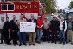 Check presentation to the local volunteer fire department in Harpers Ferry, Iowa