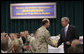 President George W. Bush shakes hands with Vice Admiral Kevin Cosgriff, Commander of the U.S. Naval Forces Central Command, during breakfast Sunday, Jan. 13, 2008, with military personnel and coalition forces at the U.S. Naval Forces Central Command in Manama, Bahrain. White House photo by Eric Draper