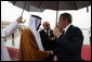 President George W. Bush is greeted by President Sheikh Khalifa bin Zayed Al Nayhan after arriving Sunday, Jan. 13, 2008, at Abu Dhabi International Airport in the United Arab Emirates. White House photo by Chris Greenberg