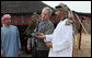 President George W. Bush holds a falcon as the Crown Prince of Abu Dhabi, Sheikh Mohammed bin Zayed Al Nayhan, stands by during dinner Sunday night, Jan. 13, 2008 in the desert near Abu Dhabi. White House photo by Eric Draper