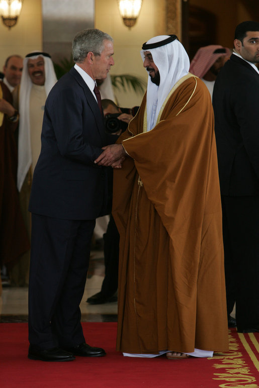 President George W. Bush shakes hands with Sheikh Khalifa bin Zayed Al Nahyan, President of the United Arab Emirates, Sunday, Jan. 13, 2008, following arrival ceremonies at Al Mushref Palace in Abu Dhabi. White House photo by Chris Greenberg