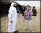 As Sheikh Abdullah bin Zayed Al Nahyan, United Arab Emirates Minister of Foreign Affairs looks on, White House Press Secretary Dana Perino holds a falcon Sunday, Jan. 13, 2008, during a dinner in the desert near Abu Dhabi. White House photo by Eric Draper