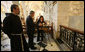 President George W. Bush lights a candle in St. Catherine’s Church during his visit to Bethlehem Thursday, Jan. 10, 2008. With him is Khouloud Daibes, Minister of Tourism, and Father Pierbattista Pizzaballa, Franciscan Custos of the Holy Land. White House photo by Eric Draper