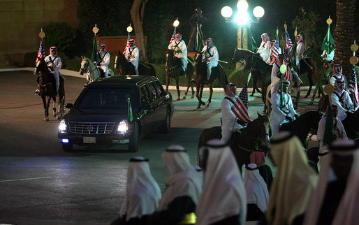 The limousine carrying President George W. Bush from Riyadh-King Khaled International Airport arrives at the Guest Palace in Riyadh Monday, Jan. 14, 2008, accompanied by a ceremonial horse procession. White House photo by Eric Draper