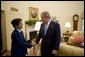 President George W. Bush welcomes 13-year-old Anurag Kashyap of Poway, Calif., the 2005 E. W. Scripps National Spelling Bee Champion, to the Oval Office Monday, July 18, 2005. White House photo by Eric Draper