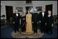 President George W. Bush and Laura Bush with Prime Minister Manmohan Singh of India and Mrs. Gursharan Kaur, before dinner in honor of their official visit Monday, July 18, 2005, at the White House. With Vice President Dick Cheney and Lynne Cheney. White House photo by Eric Draper