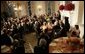 President George W. Bush addresses guests during the official dinner for India's Prime Minister Dr. Manmohan Singh, in the State Dining Room, Monday evening, July 18, 2005, at the White House. White House photo by Eric Draper