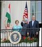 President Bush stands with India's Prime Minister Dr. Manmohan Singh, Laura Bush and Singh's wife, Mrs. Gursharan Kaur, Monday, July 18, 2005 during the Prime Minister's official visit to the White House. White House photo by David Bohrer