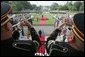 President George W. Bush and Laura Bush are seen waiting below, Monday, July 18, 2005 at the White House, as trumpeters signal the official arrival of India Prime Minister Dr. Manmohan Singh. White House photo by David Bohrer