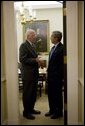 President George W. Bush confers with Senator Patrick Leahy, D-Vermont, during a breakfast meeting Tuesday, July 12, 2005, with bipartisan members of the Senate. White House photo by Eric Draper