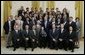 President George W. Bush stands with members of Johns Hopkins University's Men's Lacrosse team Tuesday, July 12, 2005, during Championship Day at the White House. White House photo by David Bohrer