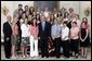 President George W. Bush stands with members of the University of Minnesota Women's Ice Hockey team during Championship Day Tuesday, July 12, 2005, at the White House. White House photo by David Bohrer