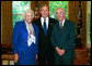 President George W. Bush stands with Supreme Court Justice Sandra Day O’Connor and her husband, John O’Connor, May 2004 in the Oval Office. Justice O’Connor submitted her resignation to the President Friday, July 1, 2005, after 24 years on the High Court to spend more time with her husband. File Photo. White House photo by Eric Draper