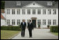 President George W. Bush is greeted by Danish Prime Minister Anders Fogh Rasmussen at his summer residence in Marienborg in Kongens Lyngby, Denmark, Wednesday, July 6, 2005. White House photo by Paul Morse