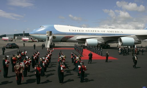 As President George W. Bush and Laura Bush disembarks Air Force One, a band is poised for their arrival at Glasgow's Prestiwick Airport, July 6, 2005. White House photo by Paul Morse